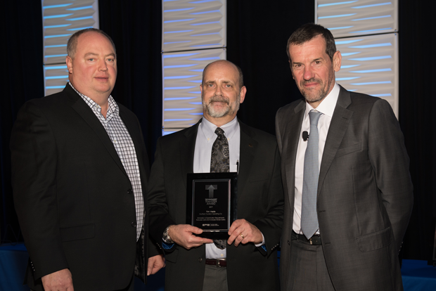 Dominion employee Kevin Hacker, Southern Nuclear employee Tim Wells, and EPRI’s Neil Wilmhurst  with a 2017 EPRI Technology Transfer Award