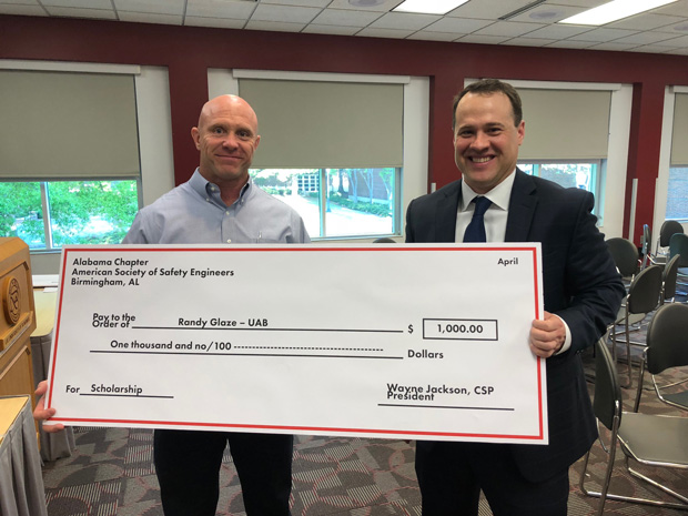 Randy Glaze with scholarship check from UAB