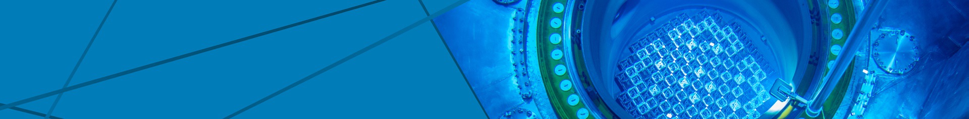 A reactor pool glows blue from Cherenkov radiation, symbolizing the core of nuclear development and innovation in energy generation.