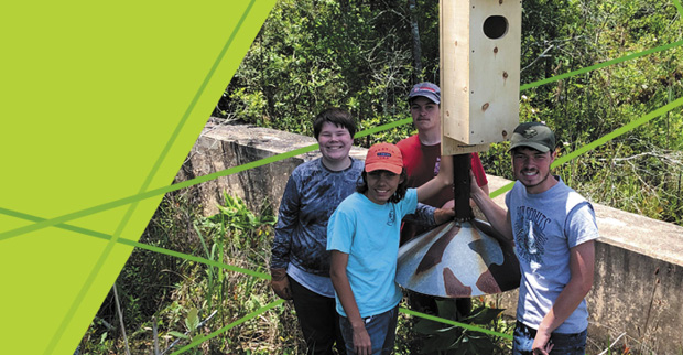 Eagle Scouts after constructing a wood duck nest box