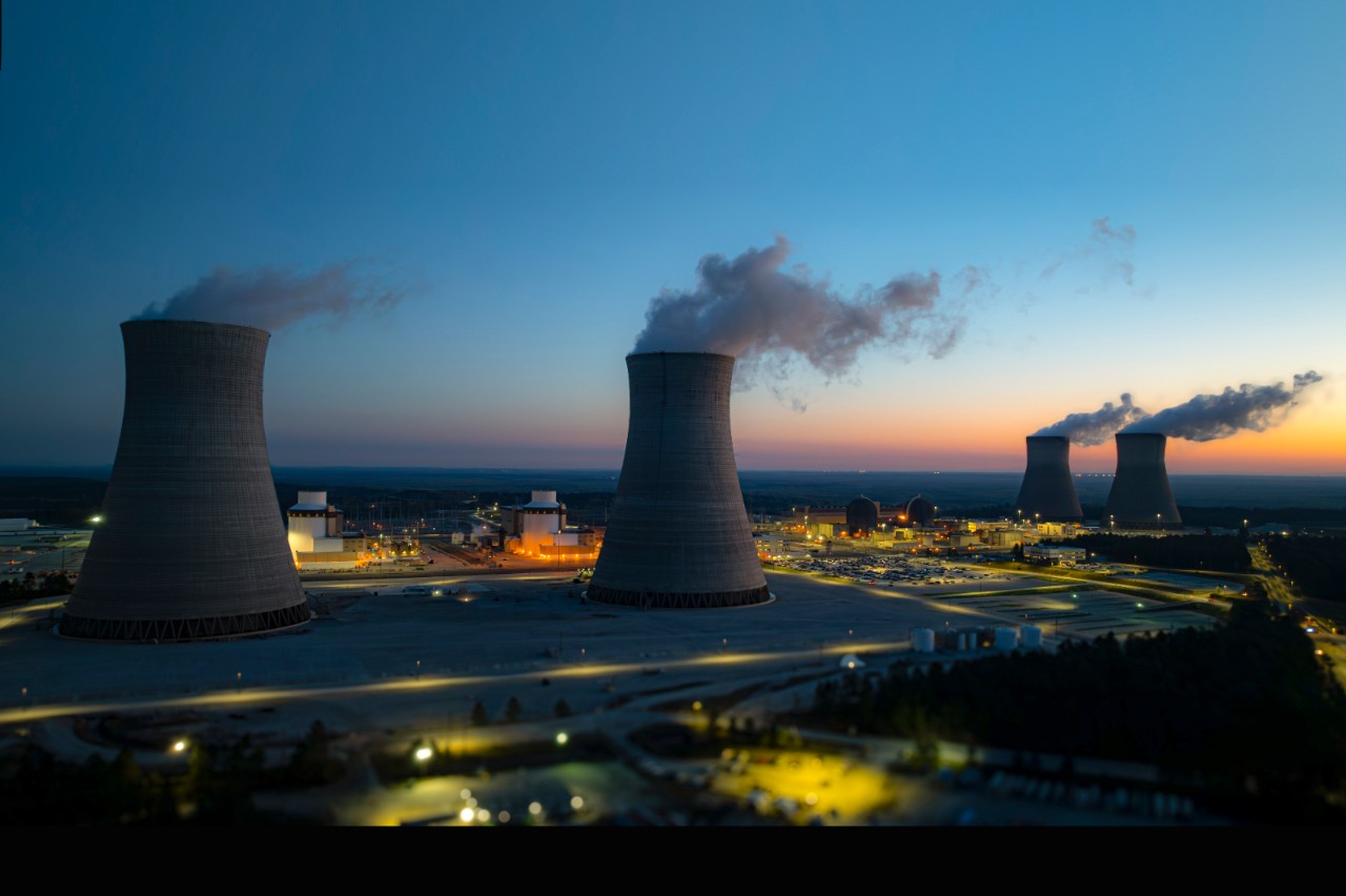 Aerial view of Hatch nuclear power plant in Georgia near a river at dusk, supporting nuclear power education and emergency planning awareness.