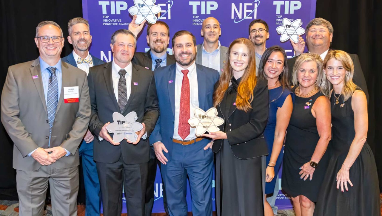 SNC Team posing for photo with TIP Awards