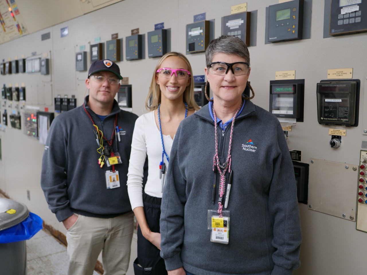 Three Southern Nuclear employees stand in Farley Nuclear Plant’s control room, highlighting the expertise behind Alabama’s nuclear operations.