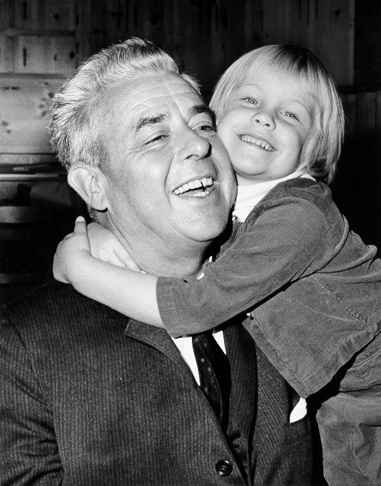 A black-and-white photo of Edwin I. Hatch smiling as a young child hugs him, highlighting the namesake of the Hatch nuclear plant in Georgia.