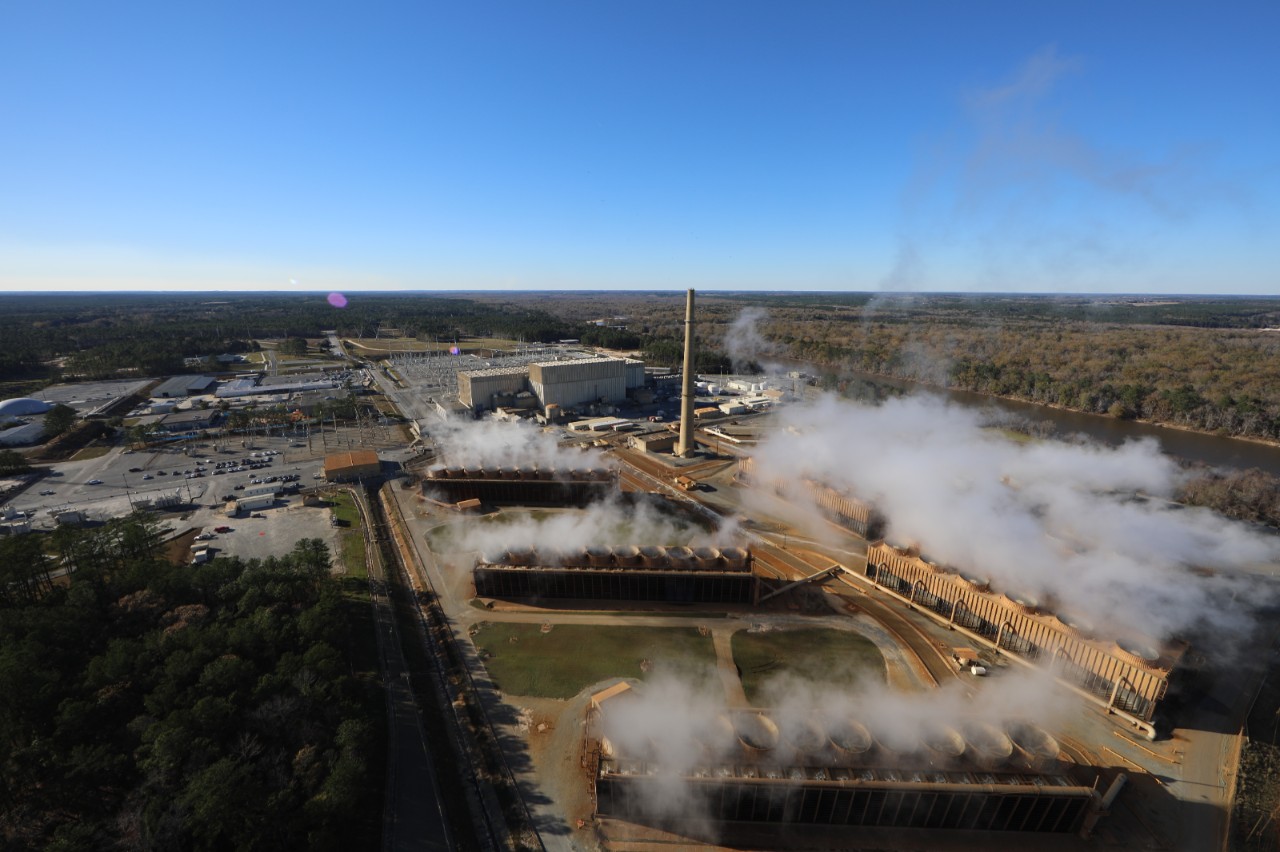 Aerial view of Plant Hatch in Baxley, GA, showing steam rising from cooling towers at the Edwin I. Hatch Nuclear Power Plant.